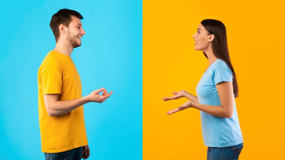 Two people holding a face-to-face conversation